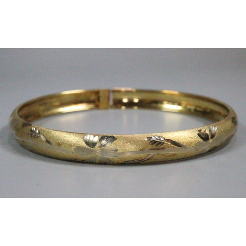 357 - 9ct gold engraved bangle.  4.7g approx.   (B.P. 21% + VAT)