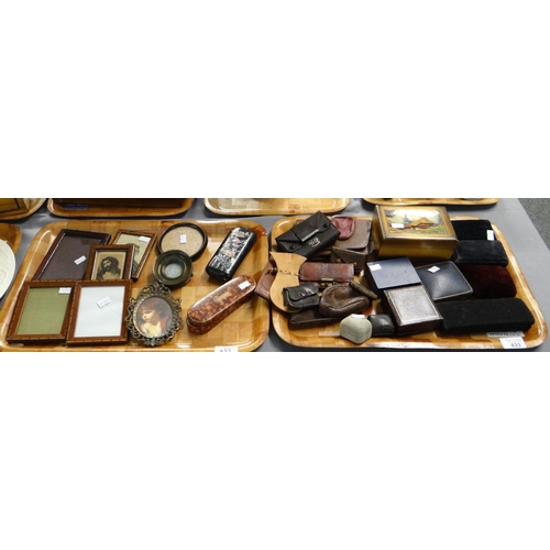 433 - Two trays of assorted items to include: wooden and other picture frames; some containing religious p... 