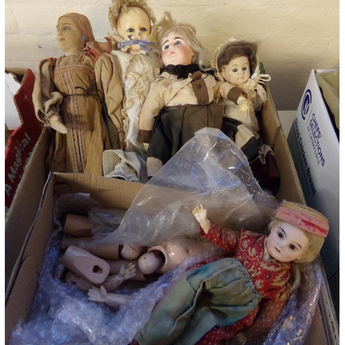 545 - Box of vintage fabric and bisque headed dolls, doll parts etc.  some with painted features and glass... 