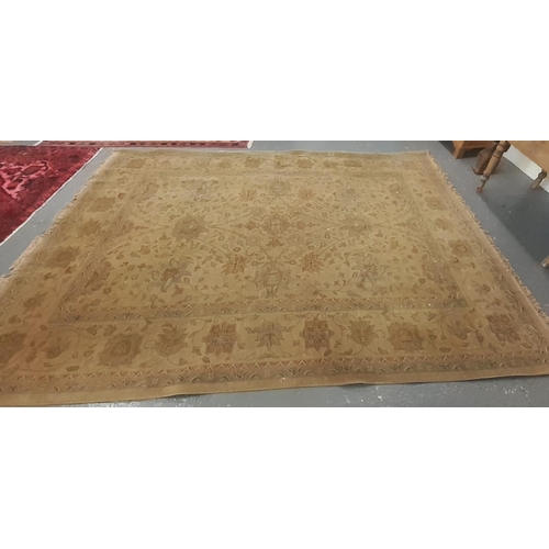 561 - Large beige ground floral and foliate carpet.  340x240cm approx.   (B.P. 21% + VAT)