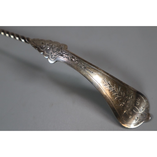 196 - Unusual antique silver toddy ladle with spiral shaft and engraved decoration, indistinct hallmarks. ... 