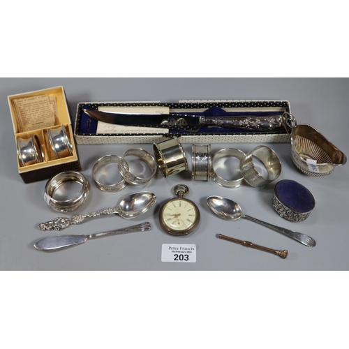 203 - Bag of assorted silver and plated items to include: napkin rings, cream jug, flatware, pin cushion, ... 