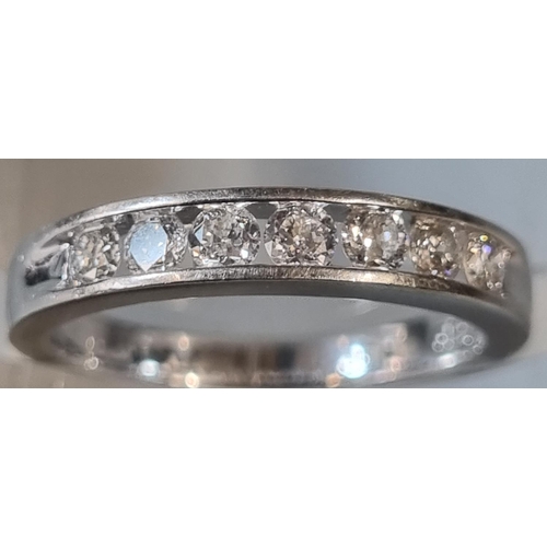 209 - 18ct white gold seven stone diamond eternity ring, marked 'forever'.  3.1g approx.  Size I.  (B.P. 2... 