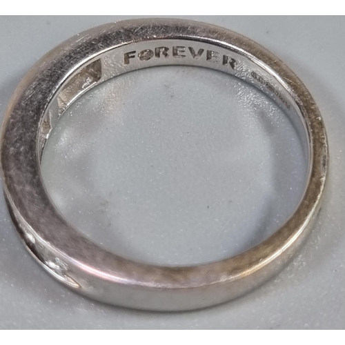 209 - 18ct white gold seven stone diamond eternity ring, marked 'forever'.  3.1g approx.  Size I.  (B.P. 2... 