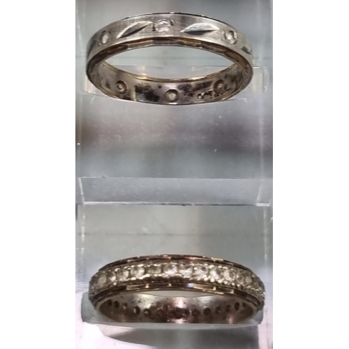 212 - 9ct white gold eternity style ring.  2g approx.  Size N1/2.  together with another 9ct gold eternity... 