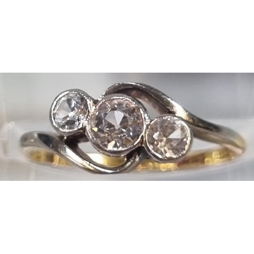 214 - 18ct gold clear three stone ring (not diamonds).  2.1g approx.  Size L1/2.  (B.P. 21% + VAT)