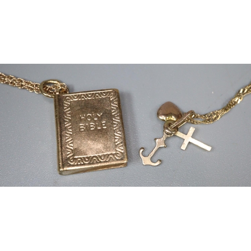 224 - 9ct gold fine link chain with a collection of charms/pendants including: anchor, letter T, and a hea... 