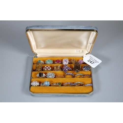 247 - Ring box comprising an assortment of twenty five silver and other dress rings with coloured stones. ... 