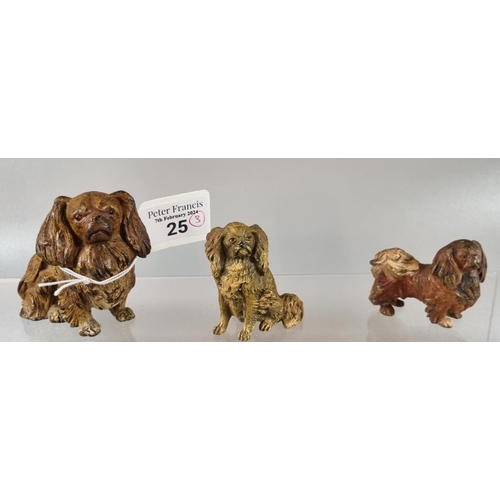 25 - Group of three cold painted bronze Pekinese type dogs in different poses, two small and one large, u... 