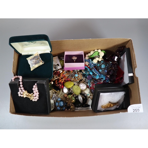 259 - Box of assorted mainly costume jewellery: brooches, necklaces, chains and pendants, earrings etc.  (... 