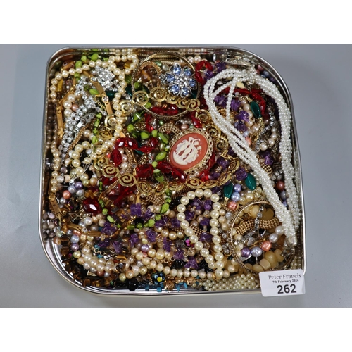 262 - Biscuit tin comprising large collection of costume jewellery. (B.P. 21% + VAT)