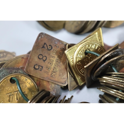 275 - Vintage Huntley & Plamers shortbread tin comprising a large collection of miner's tokens/checks to i... 