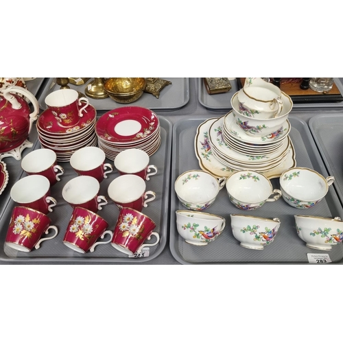 283 - Four trays of 19th century tea ware, overall decorated on white and burgundy grounds with flowers an... 