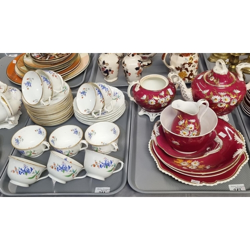 283 - Four trays of 19th century tea ware, overall decorated on white and burgundy grounds with flowers an... 