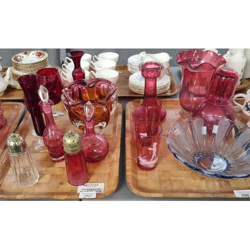 290 - Four trays of glassware to include mainly cranberry glass: jugs, specimen and other vases, cranberry... 