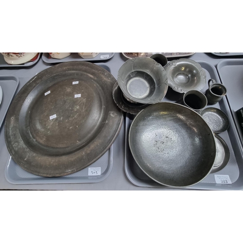 303 - Two trays of Art Nouveau, 18th century and other pewter items to include: bowls, pin dish, beaten de... 