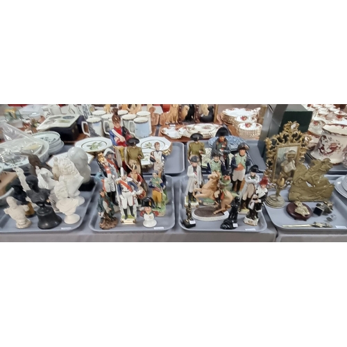 306 - Four trays of military related items to include: Continental soldiers, collection of Napoleon items ... 