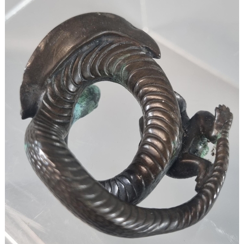 43 - Oriental possibly Japanese bronze study of a frog climbing onto a coiled snake.  Un-signed.  6.5cm w... 