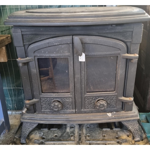 434 - Large cast iron solid fuel stove with cooking surface above two glazed doors.  70cm wide approx.  (B... 