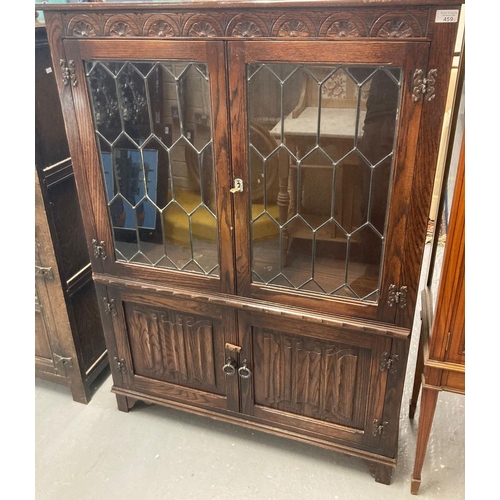 459 - Two items of 17th century style reproduction oak furniture to include: lead glazed low bookcase with... 