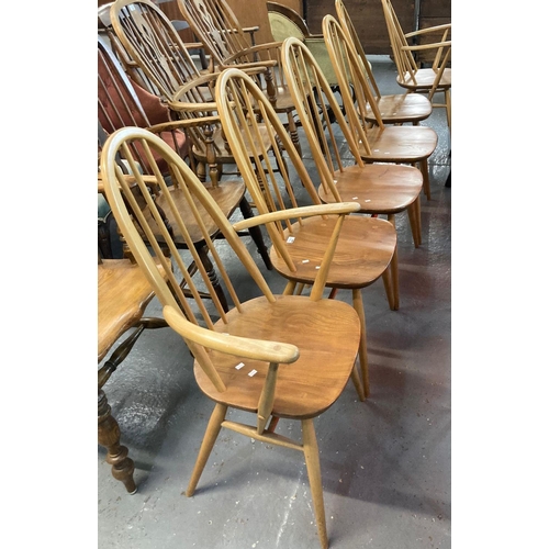 469 - Set of six Ercol natural beech and ash hoop and spindle backed dining chairs, two open arm carvers w... 