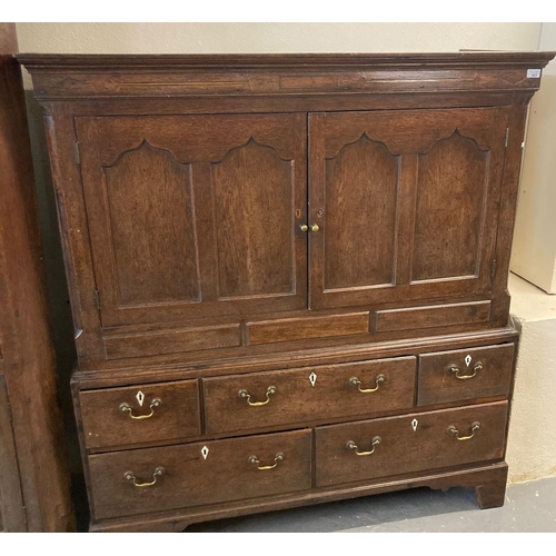 483 - Early 19th century Welsh oak two stage low press cupboard with moulded cornice above inlaid frieze, ... 