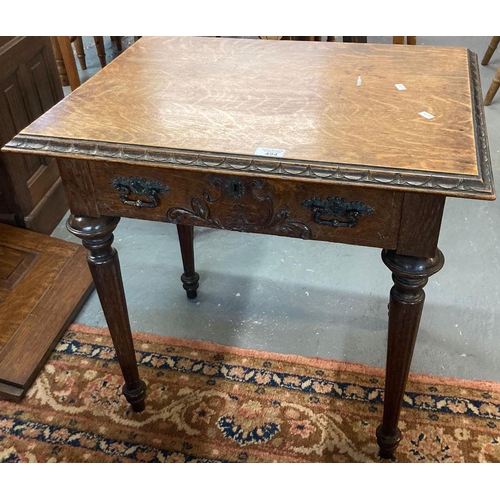 494 - Victorian oak lowboy, the moulded top above a single drawer with ornate handles and carved initials ... 