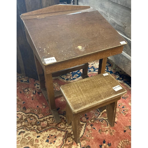 500 - Early 20th century oak child's slope fronted school desk (44cm wide approx) together with solid oak ... 