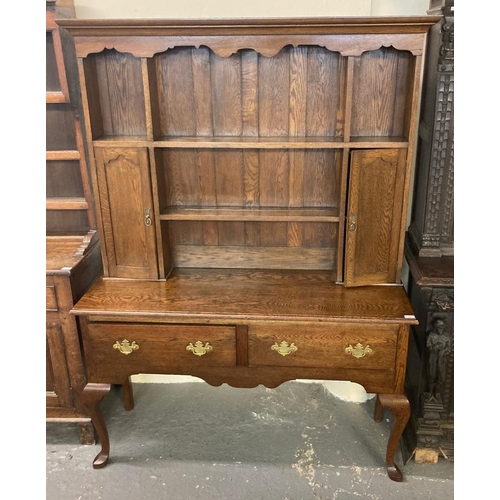 507 - 20th century oak cabriole leg dresser having associated boarded rack back, two frieze drawers, on ca... 