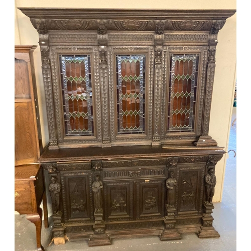 508 - Late 19th century stained oak Flemish design library bookcase with overall carved decoration of lion... 