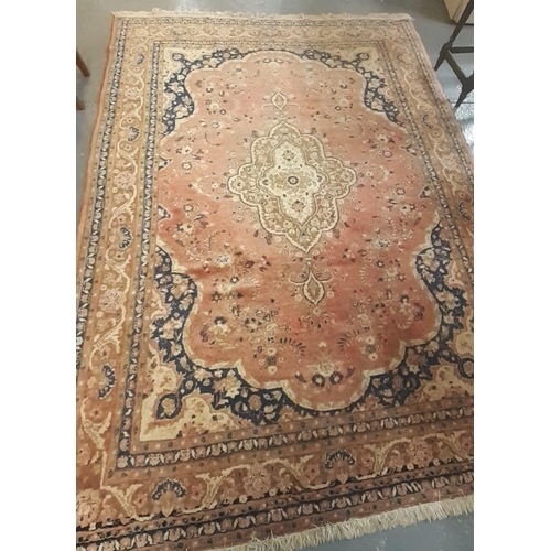 521 - Middle Eastern salmon ground carpet with over all foliate and floral designs.  320x215cm approx.  (B... 