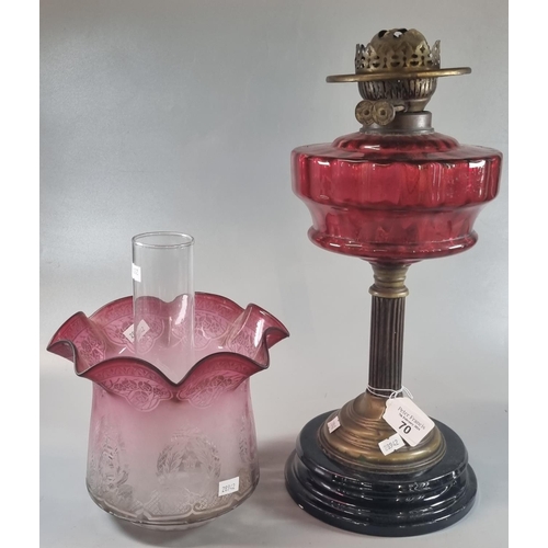 70 - Early 20th century double oil burner lamp having cranberry and etched glass shade above a cranberry ... 