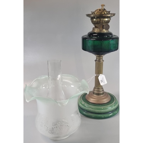 72 - Early 20th century double oil burner lamp having frilled frosted and etched glass shade above a gree... 