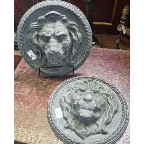 74 - Pair of probably moulded lead male lion head plaques with repeating rope twist decoration. (heavily ... 