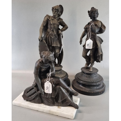 93 - Two spelter figurines, one of a Roman Soldier, both on socle bases together with another spelter fig... 