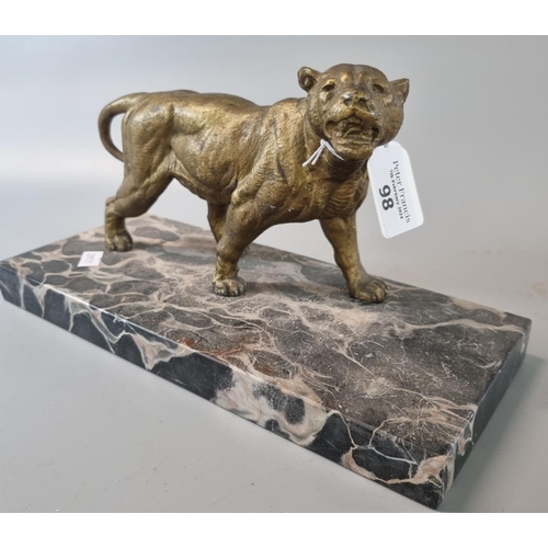 98 - Gilded spelter study of a Lioness on veined marble base.   (B.P. 21% + VAT)