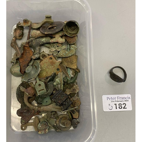 182 - Plastic tub comprising Roman, Medieval and Bronze Age metal detecting finds to include: a seal ring ... 