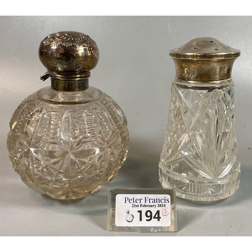 194 - Early 20th Century cut glass globular scent bottle with silver collar and lid. Together with a silve... 