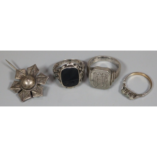 332 - 9ct gold three stone clear dress ring together with two silver signet rings and a silver brooch.  (B... 