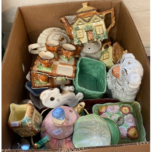 473 - Box of china to include: fireside dog, novelty teapots , egg cruet sets, Cottage Ware items etc.  (B... 