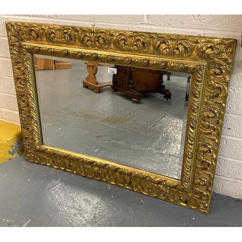 486 - Modern gilt bevelled mirror, the frame with moulded foliate designs.  105x78cm approx.  (B.P. 21% + ... 