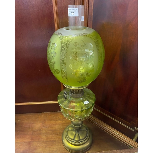 70 - Early 20th Century double oil burner lamp having green frosted glass globular shade above a green re... 