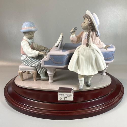 71 - Lladro 5930 Spanish porcelain 'Jazz Duo' figure group on wooden base. With original box. 
(B.P. 21% ... 