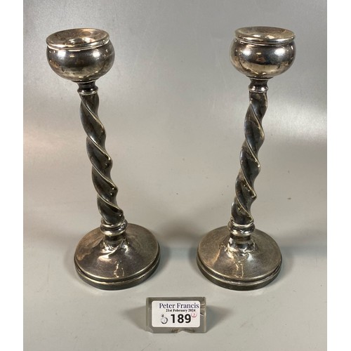 189 - Pair of George V silver barley twist candlesticks with loaded bases. Birmingham 1928.  21.5cm high a... 