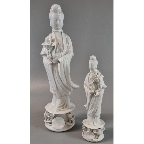 44 - Two Chines porcelain Blanc de Chine figures of Guanyin The Goddess of Mercy, both standing on Lotus ... 