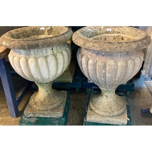 580 - Large pair of reconstituted stone fluted garden pedestal urns.  72cm high approx.  (2)   (B.P. 21% +...