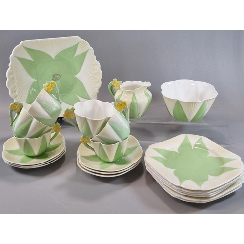 122 - Twenty one piece Shelley bone china Art Deco part tea set on a white and green ground with flowerhea... 