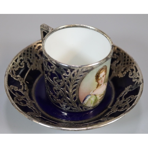 125 - Early 20th century Austrian Vienna porcelain coffee can and saucer, on a blue ground with white meta... 