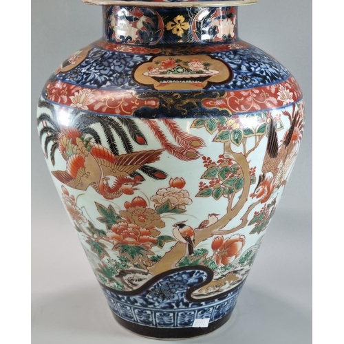 140 - Impressive Japanese export baluster jar and cover, in the Imari pallet, decorated with birds amongst... 