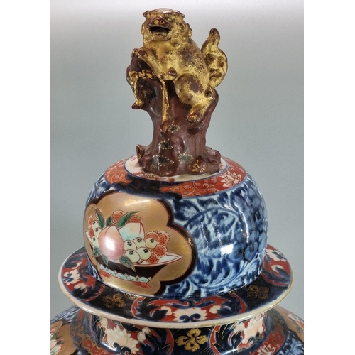 140 - Impressive Japanese export baluster jar and cover, in the Imari pallet, decorated with birds amongst... 